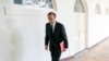 FILE - White House national security adviser Jake Sullivan walks along the Colonnade at the White House. 