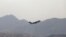 A US military aircraft takes off from the Hamid Karzai International Airport in Kabul, Afghanistan, Aug. 30, 2021.