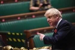 Britain's Prime Minister Boris Johnson speaks during the weekly question-time debate at the House of Commons in London, Britain, Nov. 11, 2020.