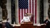 U.S. Speaker of the House Nancy Pelosi (D-CA) wields her gavel ahead of the final passage in the House of Representatives of U.S. President Joe Biden's $1.9 trillion coronavirus relief bill inside the House Chamber of the Capitol.