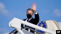 FILE - U.S. Secretary of State Antony Blinken waves as he departs, Jan. 18, 2022, at Andrews Air Force Base, Maryland, en route to Ukraine, Germany and Switzerland.