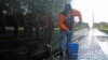 Every Sunday from April through October, Rolling Thunder volunteers gather to wash the Vietnam Veterans Memorial wall. (VOA/J. Taboh) 
