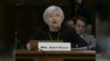 New Fed Chief Faces Reporters