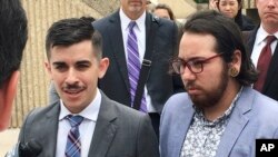 FILE - ACLU lawyer Chase Strangio, left, and plaintiff Joaquin Carcano address reporters after a hearing, June 25, 2018, in Winston-Salem, N.C., 