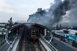 Aerial view of a burned metro station after protests in Santiago, Chile, Oct. 19, 2019. President Sebastian Pinera announced the suspension of the increase in the price of metro tickets, which triggered violent protests.