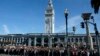 Google employees fill Harry Bridges Plaza in front of the Ferry Building during a walkout, Nov. 1, 2018, in San Francisco. Hundreds of Google employees around the world briefly walked off the job in a protest against what they said is the tech company's mishandling of sexual misconduct allegations against executives.