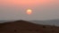 FILE - The sun sets in the Rub' al-Khali desert, which encompasses most of the southern third of the Arabian Peninsula. One reason that such regions are so dry is that they lack vertical movement of moist air.