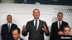 Then-U.S. ambassador to Germany Richard Grenell, Kosovo's President Hashim Thaci and Serbia's President Aleksandar Vucic attend the Munich Security Conference in Munich, Germany, February 14, 2020.