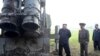FILE - North Korean leader Kim Jong Un attends the testing of a super-large multiple rocket launcher in North Korea, in this undated photo released Sept. 10, 2019 by North Korea's Korean Central News Agency. 