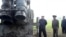 FILE - North Korean leader Kim Jong Un attends the testing of a super-large multiple rocket launcher in North Korea, in this undated photo released Sept. 10, 2019 by North Korea's Korean Central News Agency. 