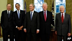 President-elect Barack Obama is welcomed by President George W. Bush for a meeting at the White House in Washington, Wednesday, Jan. 7, 2009, with former presidents, from left, George H.W. Bush, Bill Clinton, and Jimmy Carter.