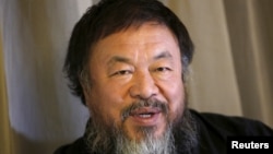 FILE - Dissident Chinese artist Ai Weiwei speaks during an interview with Reuters at his hotel in Beijing, March 24, 2015