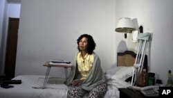 ፋይል ፎቶ - ከተሸላሚዎቹ ሴቶች አንዷ የሆነችው ቻይናዊት ኒ ዩላን (Ni Yulan) ወደ ዋሽንግተን እንዳትመጣ በቻይና መንግስት ታግዳለች