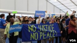 Bernie Supporters just walked into the media center (Photo A. Shaker/VOA)