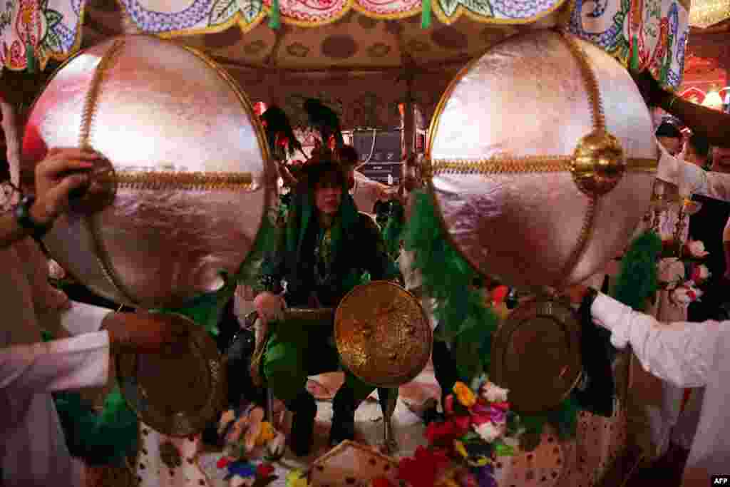 Shiite pilgrims take part in the preparations of the Ashura ceremony in Karbala, about 80 kilometers (50 miles) southwest of Baghdad, Iraq.