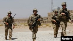 FILE - U.S. troops patrol at an Afghan National Army (ANA) Base in Logar province, Afghanistan, Aug. 7, 2018. 