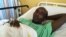Salah Sabdow Farah was shot when the bus he was traveling in was attacked by al-Shabab militants in December 2015. He is recovering at Nairobi's Kenyatta National Hospital in January 2016.(J. Craig/VOA)