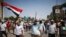 Supporters of deposed Egyptian President Mohamed Morsi march from Raba El-Adwyia square to the Republican Guards headquarters where they believe he is being held by the army in Cairo, July 7, 2013. 