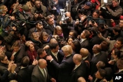 FILE - Republican presidential candidate Donald Trump, foreground right center, met with a coalition of 100 African-American evangelical pastors and religious leaders in a private meeting at Trump Tower in New York, Nov. 30, 2015.