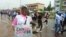  Cancer survivor Zainab Mohammad takes part in a cancer awareness walk in Abuja, Nigeria, Oct. 26, 2019. (Timothy Obiezu/VOA)