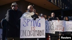 FILE - Kameelah Rashad participates in a rally for Muslim rights outside of the James A. Byrne Federal Courthouse in Philadelphia, Jan. 13, 2015. The rally followed a U.S. Court of Appeals hearing seeking to overturn the dismissal of Hassan v. City of New