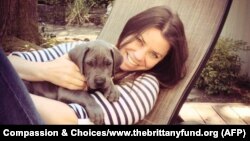 FILE - Brittany Maynard, shown with her Great Dane puppy, Charlie, took a lethal dose of medication prescribed by a doctor in Oregon on Saturday. Maynard was battling brain cancer.