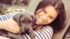 FILE - Cancer patient Brittany Maynard, shown with her Great Dane puppy, on Saturday took a lethal dose of medication prescribed by a doctor.