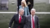 FILE - Mark Meadows, left, Robert O'Brien and Kellyanne Conway step off Marine One, March 28, 2020, in Washington. The three were named in a watchdog report that found 13 Trump administration members had willfully violated the Hatch Act.