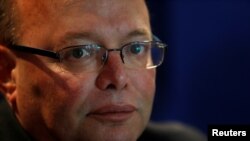 FILE - Lawrence Cutajar, who resigned as Malta's police commissioner Jan. 17, 2020, talks to reporters about investigations into the killing of journalist Daphne Caruana Galizia, at police headquarters in Floriana, Malta, Oct. 19, 2017.