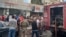 People and first responders gather at the scene of a reported device explosion in Saida in southern Lebanon on September 18, 2024.