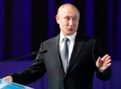 FILE - Russian President Vladimir Putin gestures as he delivers a speech in Moscow, July 3, 2019.