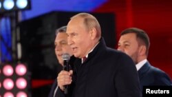 Президент Росії Володимир Путін на концерті після анексії РФ окупованих російськими військами українських територій. Москва, 30 вересня 2022. Sputnik/Sergei Karpukhin/REUTERS