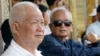 FILE - Former Khmer Rouge leaders Khieu Samphan, left, and Nuon Chea sit together during funeral services for the first wife of Khmer Rouge leader Pol Pot, July 3, 2003. The two were convicted Friday of war crimes.