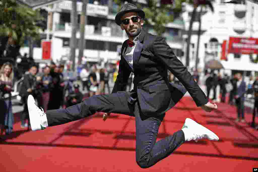 Director JR poses for photographers upon arrival at the screening of the film Visages, Villages, at the 70th international film festival, Cannes, southern France.