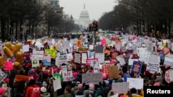 FILE - Thousands of people participate in the Third Annual Women's March at Freedom Plaza in Washington, Jan. 19, 2019. 