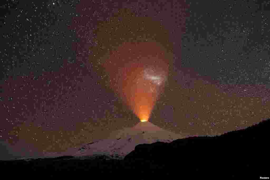 The Villarrica Volcano is seen at night from Pucon town, Chile.