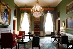 This Sept. 17, 2019, photo shows repurposed window treatments in the Green Room of the White House.