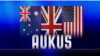 ទង់ជាតិ​នៃ​ប្រទេស​អូស្ត្រាលី អង់គ្លេស និង​អាមេរិក និង​អក្សរ «AUKUS» ដែល​ជា​អក្សរកាត់​នៃ​កិច្ចព្រមព្រៀង​ភាព​ជា​ដៃគូ​ថ្មី​មួយ​ផ្នែក​សន្តិសុខ​ត្រីភាគី​រវាង​សហរដ្ឋ​អាមេរិក និង​អង់គ្លេស​ជាមួយ​អូស្រ្តាលី។