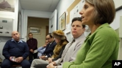 Elder abuse attorney and specialist Joy Solomon, right, speaks during a class at a condominium in New York, Jan. 7, 2014, on teaching doormen and building staff how to identify and what to do if they spot cases of elder abuse.