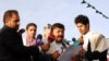 Radwan al-Haimi (R) holds a microphone as Mohammed Ali al-Houthi, President of the Houthi’s Revolutionary Committee, speaks to the media, January 23, 2015. (Photo courtesy of Radwan al-Haimi, Sana’a, Yemen.)