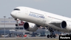 FILE - An Airbus A350 takes off at the aircraft builder's headquarters in Colomiers near Toulouse, France, Sept. 27, 2019.