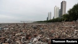 Plastic waste piles and debris are seen near the beach in Panama City, July 19, 2019.