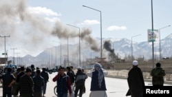 Afghanistan -- Smoke rises from the site of a blast and gunfire between Taliban and Afghan forces in PD 6 in Kabul, March 1, 2017