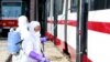 Members from an emergency anti-epidemic headquarters in Mangyongdae District, disinfect a tramcar of Songsan Tram Station to prevent new coronavirus infection in Pyongyang, North Korea, Feb. 26, 2020.