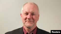 Nepalese villagers carry their belongings as they move to safer ground, in Bardia, western Nepal, Aug. 15, 2014.