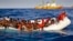 Migrants ask for help from a dinghy boat as they are approached by the SOS Meditrranee's ship Aquarius, background, off the coast of the Italian island of Lampedusa, April 17, 2016.
