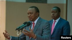 Le président Uhuru Kenyatta et son ministre de l'Intérieur Fred Matiangi à Nairobi, Kenya, le 14 août 2017.