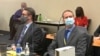 Defense attorney Eric Nelson, left, and former Minneapolis police officer Derek Chauvin listen as Hennepin County Judge Peter Cahill presides over pre-trial motions prior to opening statements, March 29, 2021.