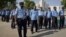 Policemen keep guard outside the Supreme Court of Pakistan building in Islamabad June 19, 2012. 