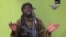 FILE - This image taken from video by Nigeria's Boko Haram in May 2014 shows leader Abubakar Shekau; a pledge of allegiance to Islamic State by the group has been attributed to him. 